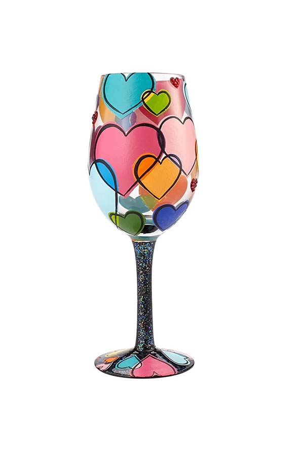 Llena tus momentos especiales de color y amor con esta copa de vino "Love is All" de Lolita. Diseñada con corazones vibrantes y colores brillantes, su base y tallo están decorados con detalles de purpurina, añadiendo un toque de glamour y alegría. Ideal para regalar o disfrutar en una noche especial.