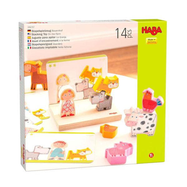 La caja de "Haba Apilar la Granja" muestra una escena encantadora con los animales y el granjero. Un juego educativo para niños a partir de 2 años, ideal para desarrollar la coordinación mano-ojo.