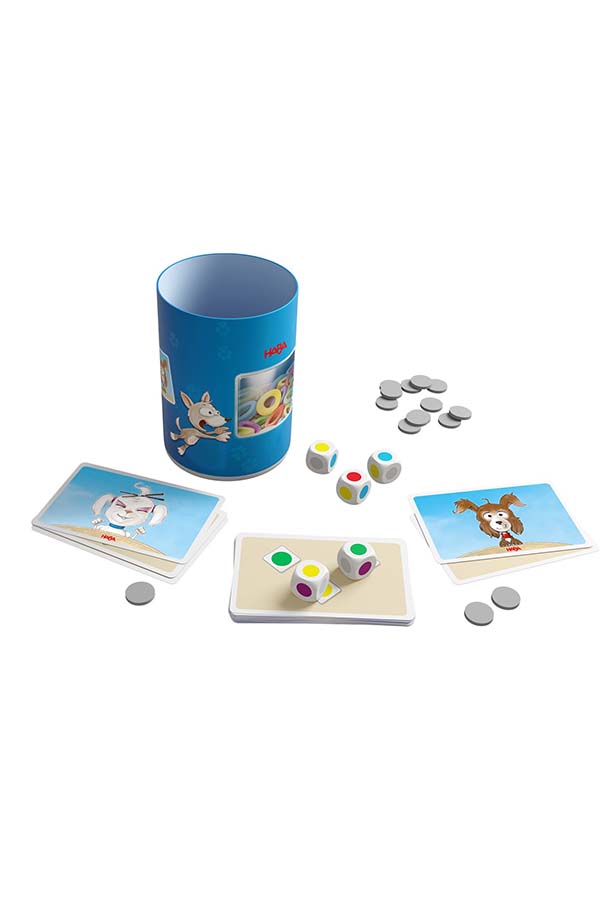 Contenido del juego "Golosinas Caninas" de HABA. Incluye fichas de comida para perros, dados y tarjetas con diferentes personajes. Un divertido reto para niños mayores de 5 años.