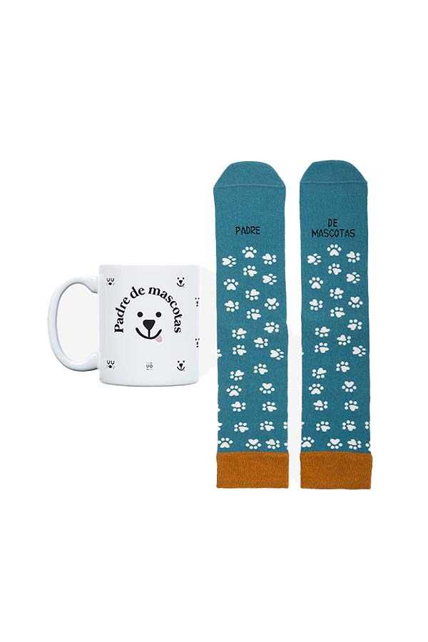 Un set ideal para los amantes de los animales. Incluye una taza blanca con diseño de un perro sonriente y la frase "Padre de mascotas", junto con un par de calcetines azules con estampado de huellas y detalles en marrón en la puntera y el talón.