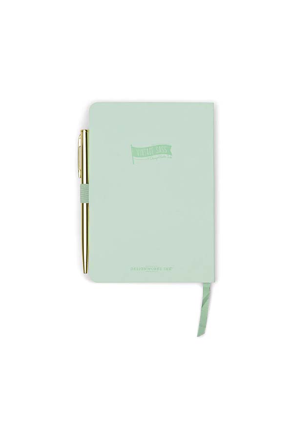 Parte trasera del cuaderno "Leaf Me Alone" con bolígrafo dorado