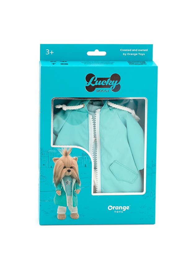 Este set incluye un abrigo impermeable turquesa con capucha, jersey con estrella plateada y pantalón blanco, presentado en su caja original Lucky Doggy. Ideal para regalar o coleccionar.